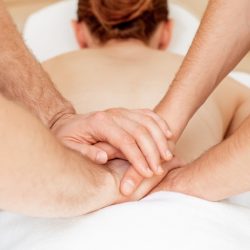 Young white woman having thai massage.